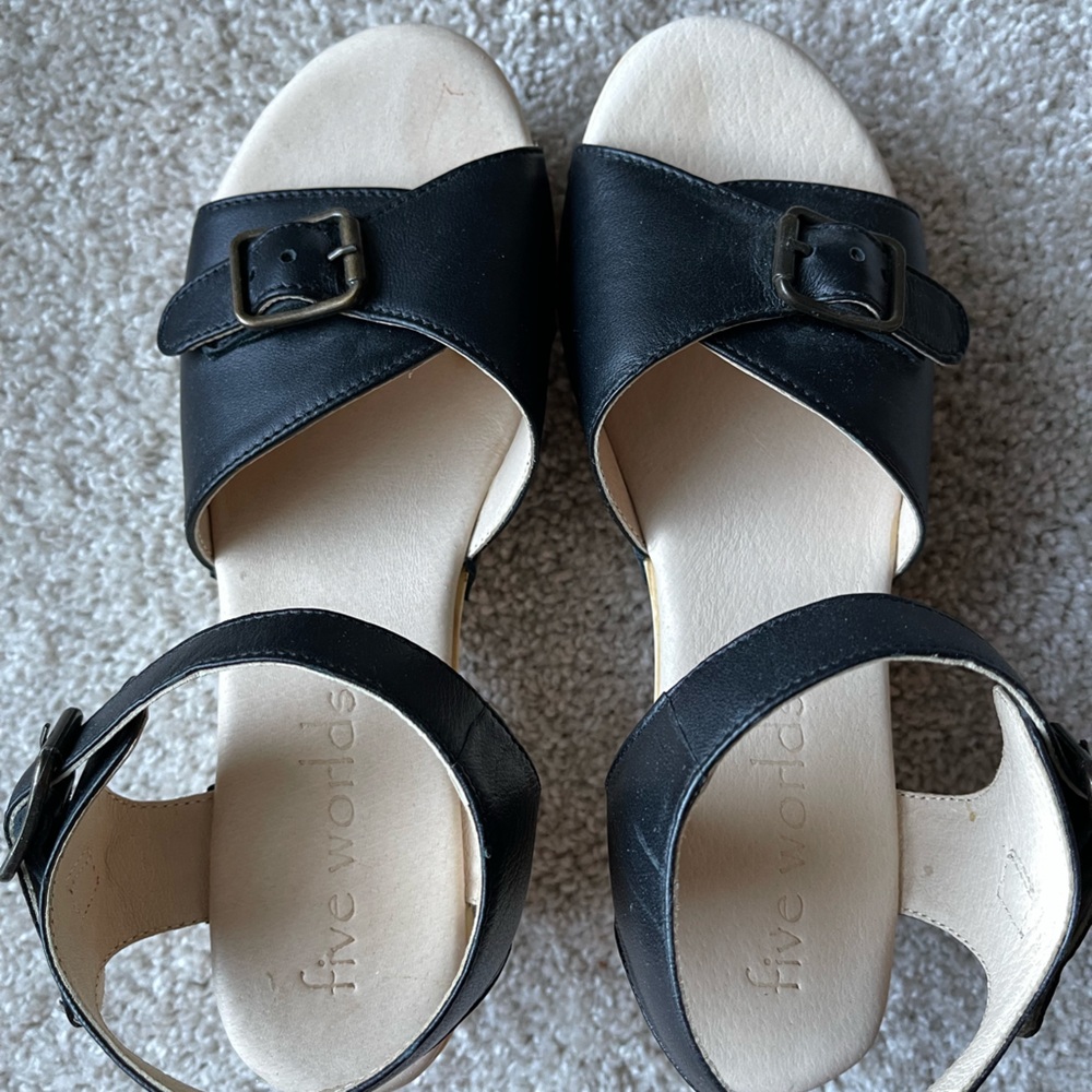 Worn once, purchased from Gilt, bottoms are real wood, but not terribly heavy.
